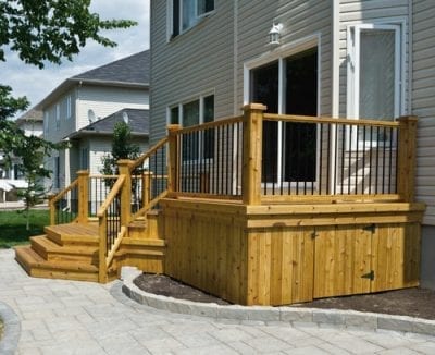 Backyard wooden deck with railings