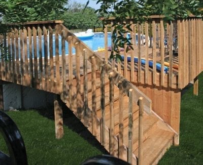 Wooden pool deck with railings