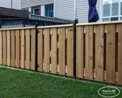 custom jockvale wood fence w/steel posts