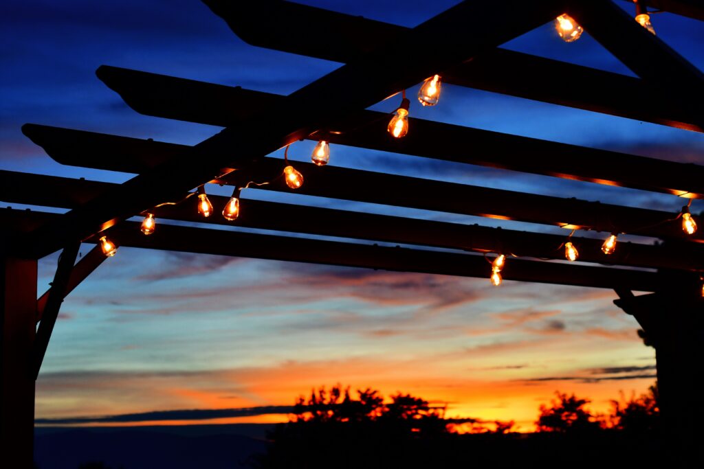 A pergola in Ottawa featuring string lights as the sun sets