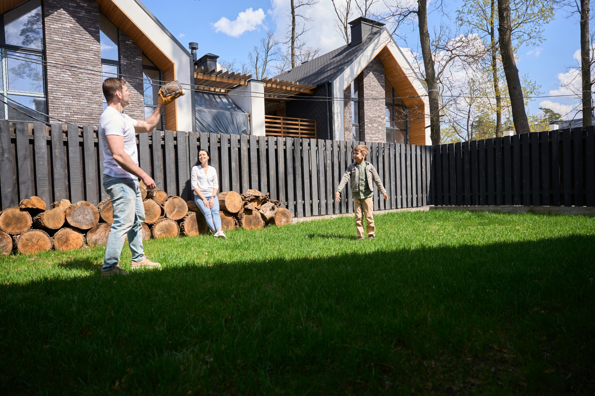 A man spending time with a child near his private house