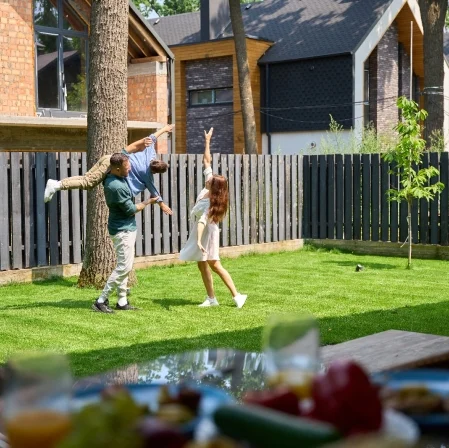 Family enjoying fenced backyard