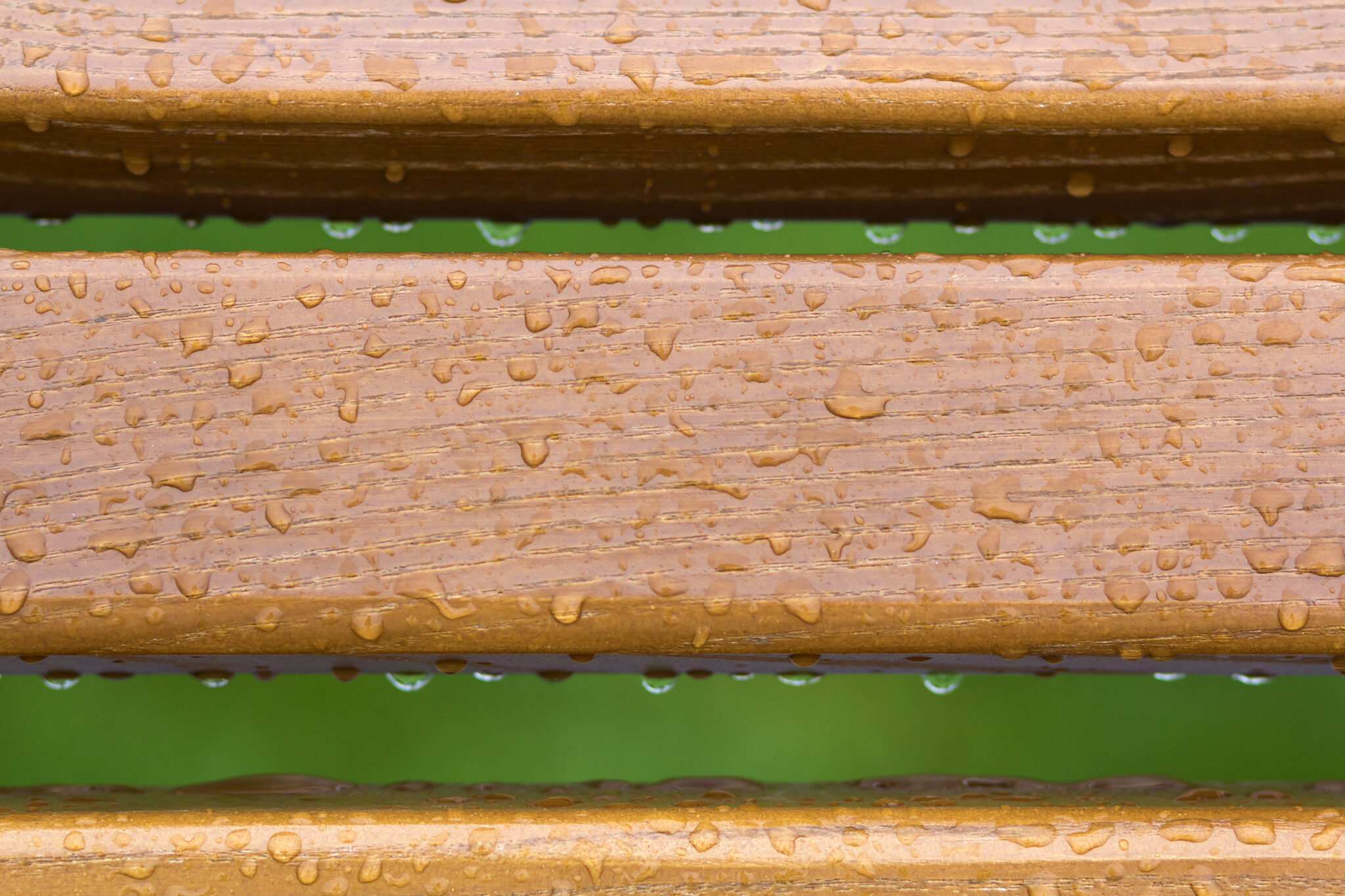 A fence being built in inclement rainy weather.