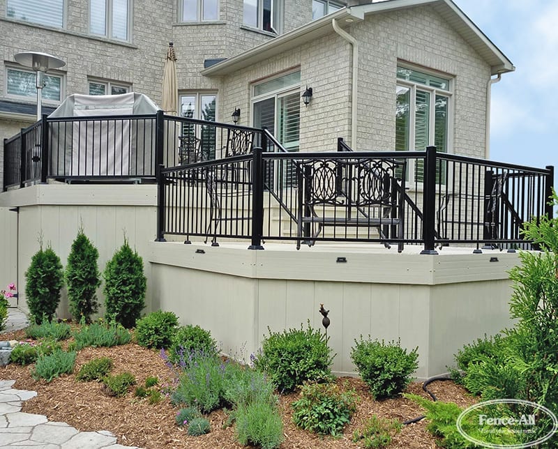 Multi-level Cellular PVC deck with black aluminum railings, designed for outdoor entertaining and low-maintenance backyard living in Ottawa.