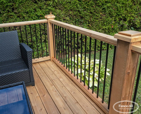 wood railing w/3/4″ round metal pickets on wrapped posts