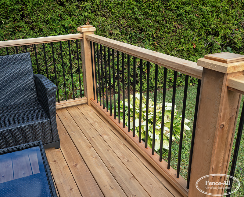 wood railing w/3/4″ round metal pickets on wrapped posts