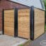 Custom wood backyard storage enclosure for garbage and recycling bins by Fence-All in Ottawa.