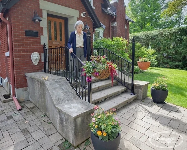 custom welded iron railing w/flower hangers